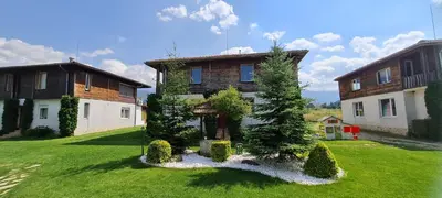 a large house with a yard with grass and trees at Villa Nikol Apt #1 in Raduil