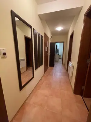 a hallway with mirrors and a tile floor at Apartment in Castle 1 in Pamporovo