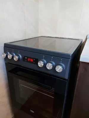a black stove with a timer on top of it at Studio GERONIMO in Pamporovo