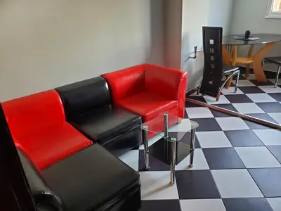 a living room with a couch and a table at Романтично Място Ани in Plovdiv