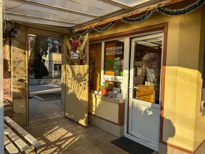an entrance to a store with a door open at Hotel Darling in Bankya