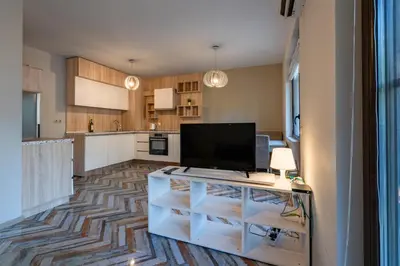 a kitchen with a tv on top of a cabinet at Bright 1BDR Apartment with a Balcony in Sofia