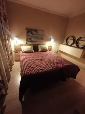 a bedroom with a bed with two pillows on it at Homey art apartment next to Drujba lake Metro stations and bul.Tsarigradsko Shose in Sofia