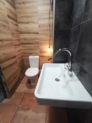 a bathroom with a sink and a toilet at Homey art apartment next to Drujba lake Metro stations and bul.Tsarigradsko Shose in Sofia