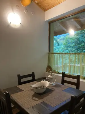 a dining room table with a bowl on it and a window at Вила Ренесанс Костенец in Kostenets Village