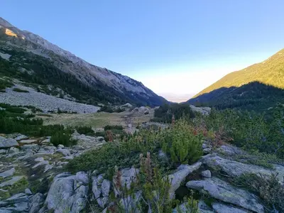 a view of a mountain with rocks and trees at Bansko Royal Towers T&K in Bansko