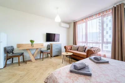 a living room with a couch and a table at WOW studios for rent - bul Montevideo 25A - B in Sofia