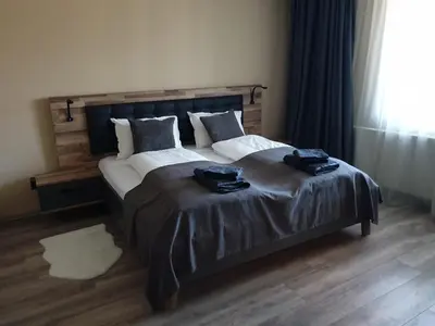 a bedroom with a bed with two towels on it at Casa Veneta in Oreshak