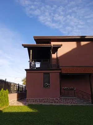 a house with a balcony on the side of it at Casa Veneta in Oreshak