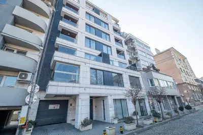 an apartment building on a city street at City Apartments - Mall of Sofia & Metro Station in Sofia