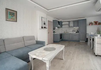 a living room with a couch and a table at Sunny & Stylish Brand new 2bdr Apartment + Parking in Sofia