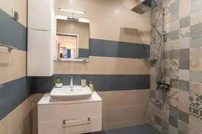 a bathroom with a sink and a shower at Sunny & Stylish Brand new 2bdr Apartment + Parking in Sofia