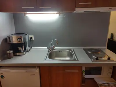 a kitchen counter with a sink and a coffee maker at Studio Villa Park 410 in Borovets