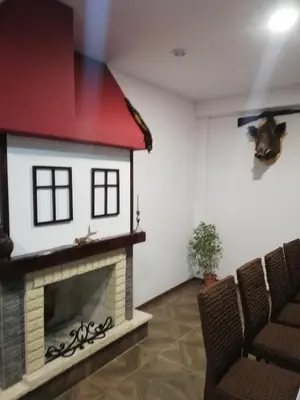 a living room with a dog house on the wall at Вила ОБЗОР in Progled