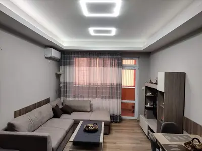 a living room with a couch and a table at Apartment Anelia 1 in Plovdiv