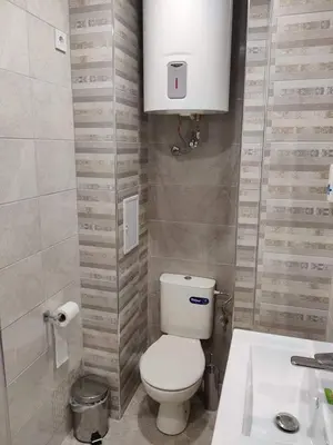 a small bathroom with a toilet and a sink at Apartment Anelia 1 in Plovdiv