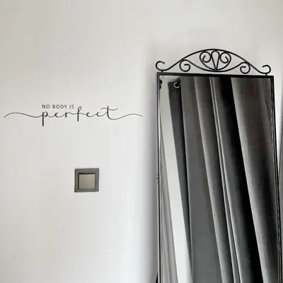 a curtain in a room with the words no room is perfect at ATRIUM Boutique Suites Sofia in Sofia