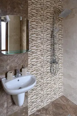 a bathroom with a sink and a shower at Семеен хотел При Вергил in Sapareva Banya