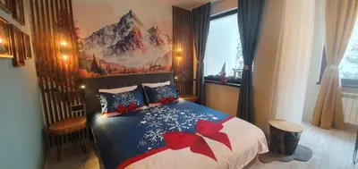 a bedroom with a bed with a red bow on it at FOX boutique apartment Borovets Gardens in Borovets