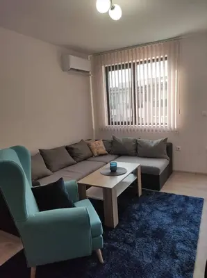 a living room with a couch and a table at Your place in Plovdiv