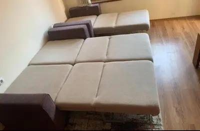 a living room with a brown couch in a room at Sunny home by the lift in Bansko in Bansko