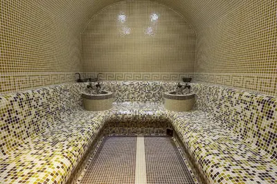 a bathroom with three sinks in a tiled room at Skyday Penthouse Deluxe at Oak Residence in Smolyan