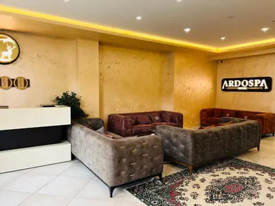 a lobby with couches and a sign on the wall at Ardo Spa Hotel and Restaurant in Sarnitsa