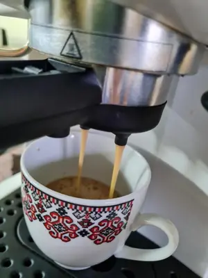 a coffee maker is making a cup of coffee at Riverpark Holiday Apartment, Sandanski in Sandanski