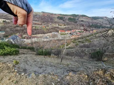 a hand pointing at a city from a hill at Riverpark Holiday Apartment, Sandanski in Sandanski