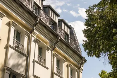 a building with balconies on the side of it at VIZUALIZA Residence Hotel by HMG in Plovdiv