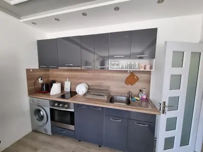 a kitchen with a sink and a stove at Luxury two bedroom Crown apartament in Botevgrad