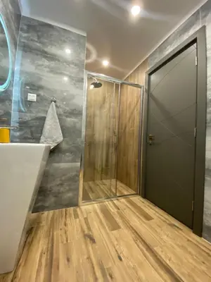 a shower with a glass door in a bathroom at DV13 Luxury Suite Sofia Center in Sofia