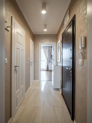 a hallway of a home with a door and a hallway at The Boulevard Luxury Apartment in Sofia