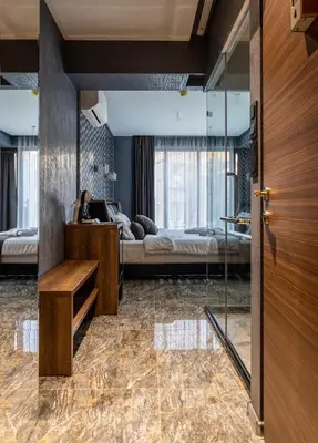 a room with two beds and a glass door at HIDDEN BANK: DIAMONDS in Plovdiv