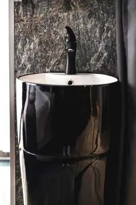 a black and white sink with a black faucet at HIDDEN BANK: DIAMONDS in Plovdiv