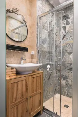 a bathroom with a sink and a shower at Floral Studio Retreat in Sofia City Center by Flat Mаnager in Sofia