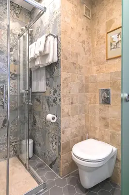 a bathroom with a toilet and a shower at Floral Studio Retreat in Sofia City Center by Flat Mаnager in Sofia