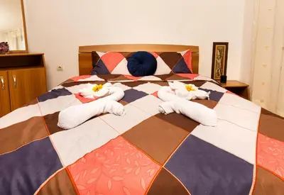 a large bed with towels on top of it at Lovely 1BD Apartment close to the Summer Theatre by Flat Mаnager in Plovdiv
