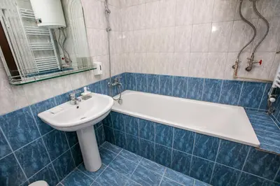 a bathroom with a sink and a tub and a toilet at Paradise Apartment in Sandanski