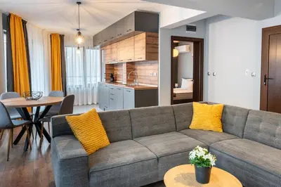 a living room with a couch and a table at Апартаменти 22 in Velingrad