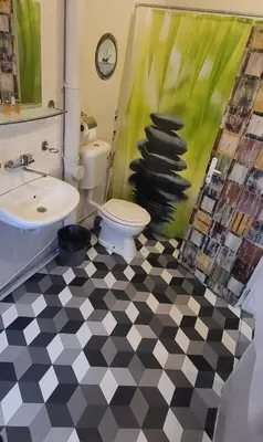 a bathroom with a toilet and a sink at Hotello in Sofia