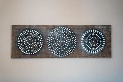 a painting of three circles on a wall at Lovely apartment in Studentski grad in Sofia