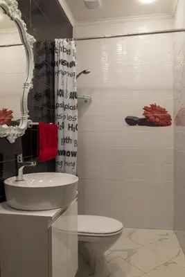 a bathroom with a toilet and a sink and a mirror at Harmony Centrally Located Studio in Sofia
