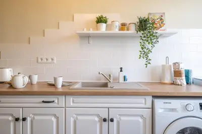 a kitchen with a sink and a washing machine at Sunrise 1BDRM View Apartment NDK Congress Centre in Sofia