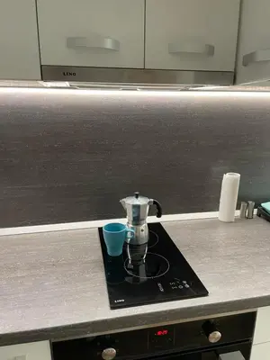 a coffee maker on a counter in a kitchen at Pine Tree Apartment / Borovets Gardens in Borovets