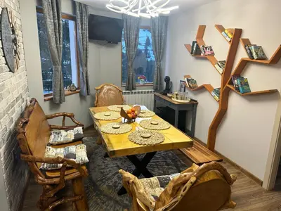 a dining room with a table and chairs at House Proctor in Stoykite