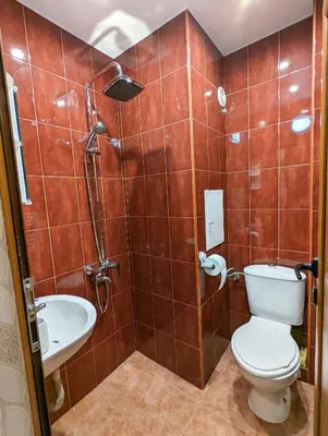a bathroom with a toilet and a sink at Top Center Relax, NDK & Vitoshka & Metro station in Sofia
