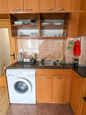 a kitchen with a sink and a washing machine at Top Center Relax, NDK & Vitoshka & Metro station in Sofia