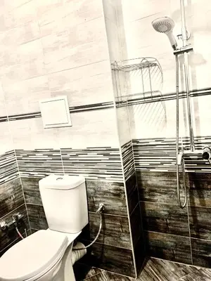 a bathroom with a toilet and a shower at City Residence Apartments Sofia in Sofia