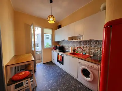 a kitchen with a sink and a washing machine at The Best Place in the heart of Sofia City center in Sofia